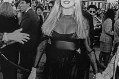 American actress Kim Basinger attends the premiere of 'Batman', held at the Mann Village Theater in Los Angeles, California, 19th June 1989. Mario's Italian Restaurant is visible in the background.  (Photo by Vinnie Zuffante/Getty Images)