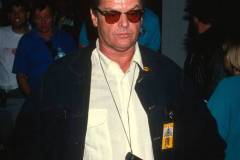 American actor Jack Nicholson, a pair of binoculars around his neck, attends a premiere of 'Batman' at the Mann Bruin Theater, Westwood, California, June 19, 1989. (Photo by Ron Galella, Ltd./Ron Galella Collection via Getty Images)